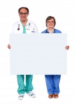 Doctor and nurse holding blank white sign