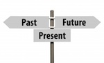 "Past," "Present," and "Future" text on road-sign arrows
