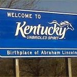 Blue "Welcome to Kentucky" street sign