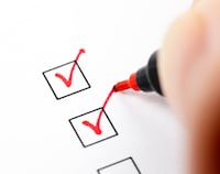 Checklist with red check marks