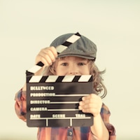 child dressed as director