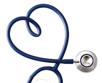 stethoscope in the shape of a heart against white background