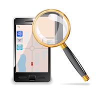 Cell phone and magnifying glass next to it representing mobile search