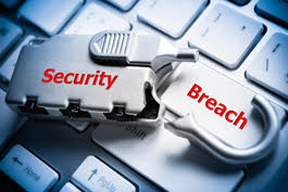 Security Breach written on metal tools on keyboard