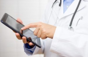 doctor using digital device