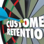 Dart board with "Customer Retention" bulls-eye
