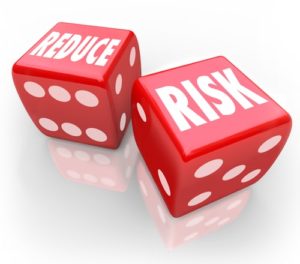 Red dice with "Reduce Risk" text on it