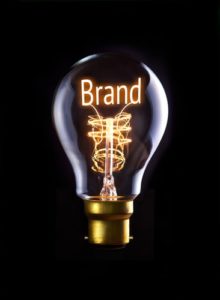 Lightbulb displaying "Brand" text against black background