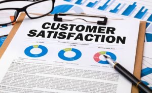 Customer Satisfaction statistics on a clipboard