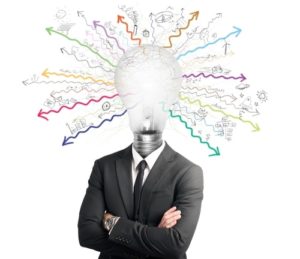 Person in a suit with an animated lightbulb as their head & colorful arrows coming out of it