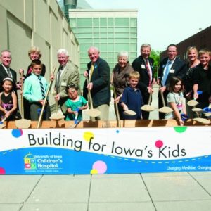 group of people attending "Building for Iowa kids" children's hospital event