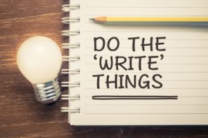 Lightbulb next to notebook with "Do the 'write' things" text written on it
