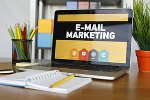 laptop screen text reading "e-mail marketing"