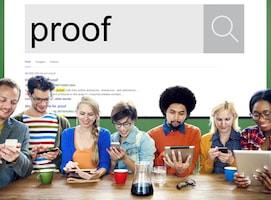 people on devices with search bar on wall reading "proof"