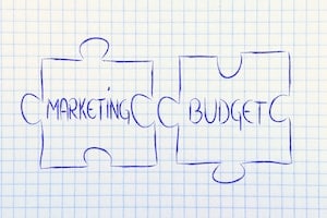 two drawn puzzle pieces spelling out "marketing budget"