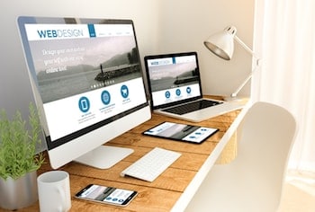 Desktop computer, laptop, iPad, and smartphone all displaying "Web Design" screen