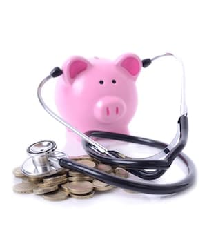 Piggy bank using a stethoscope to listen to the pile of change on the floor