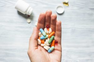 photo of hand holding pills that represent marketing medicine