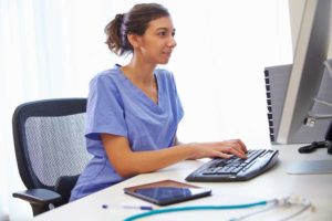 woman searching for organic healthcare marketing on computer