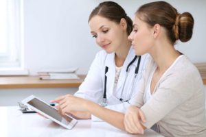doctor and woman use tablet