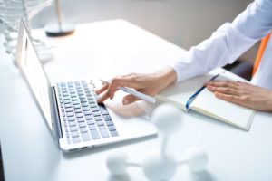 doctor typing for content marketing