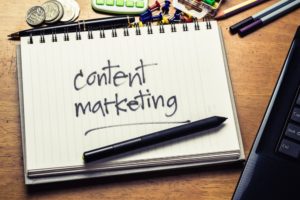 Notepad with the phrase, content marketing, written