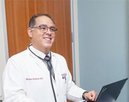 smiling doctor with glasses