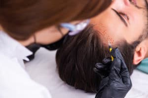 man undergoing hair restoration procedure