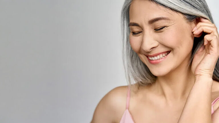 Woman Smiling on gray background